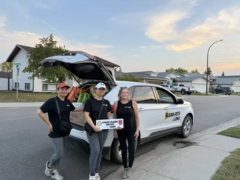 Klean-Rite team delivering donations for the Salvation Army Food Bank Drive in Grande Prairie